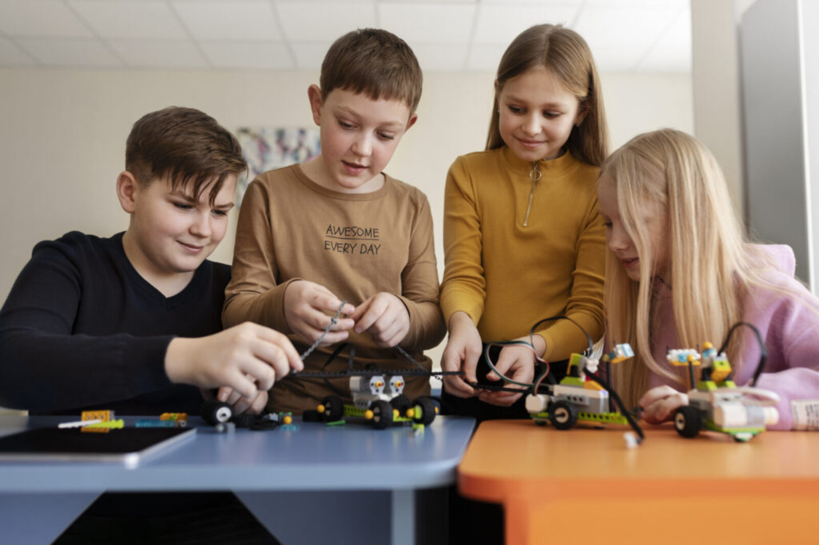 four-kids-building-drone-using-electronic-parts four-kids-building-drone-using-electronic-parts